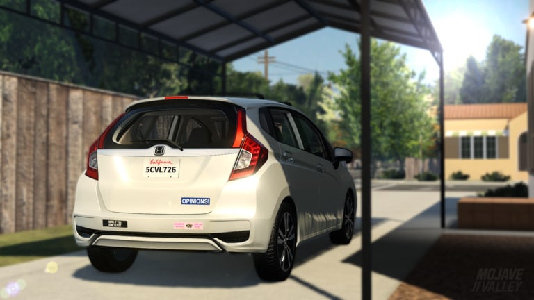 White hatchback parked in a Mojave Valley residential carport